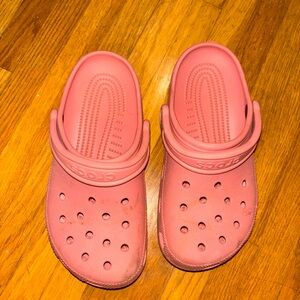 Crocs with wear as shown in photos